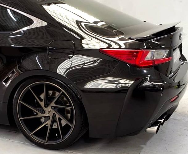 Black sports car rear wheel detail